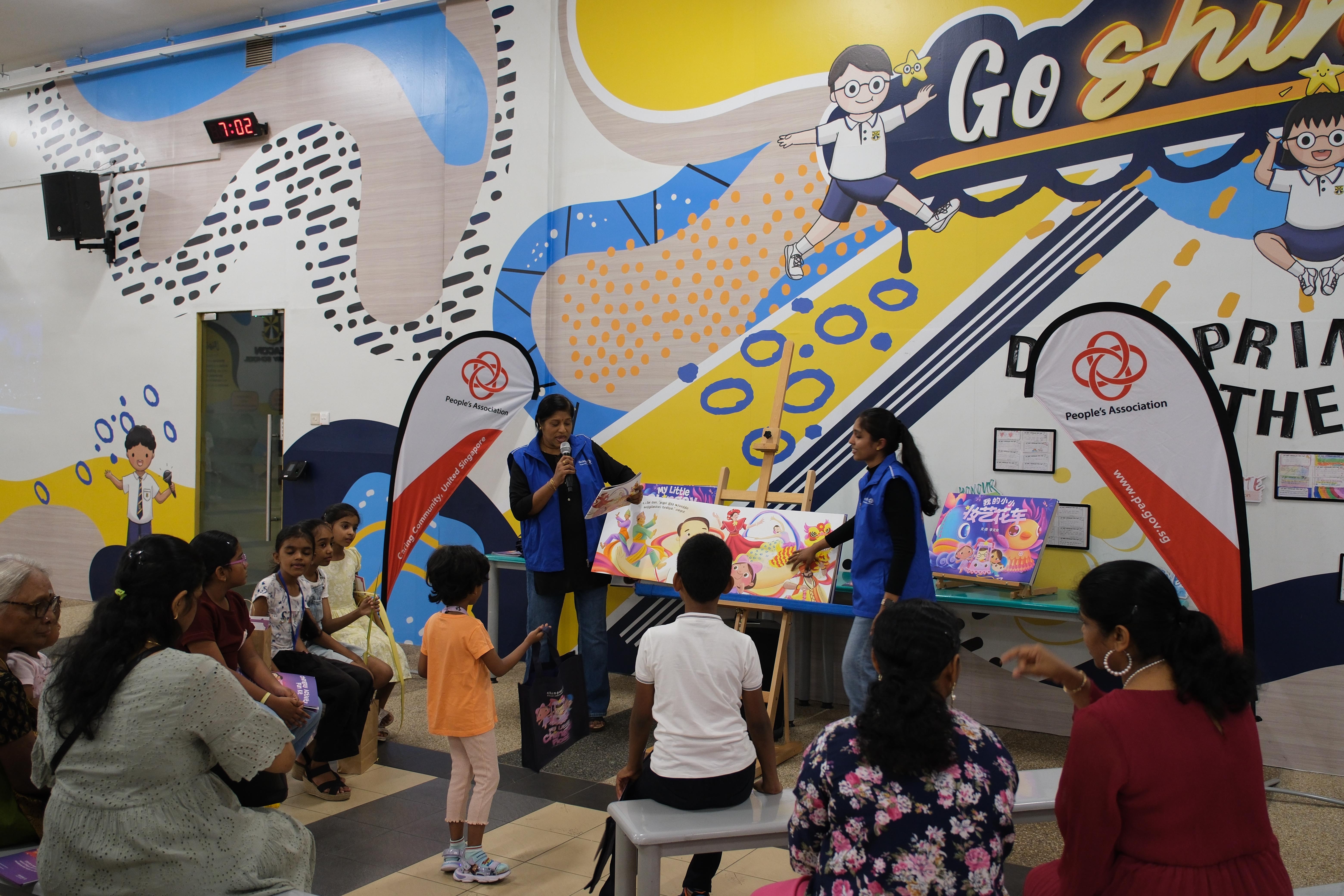 Stories that bring us together! Families gather for an engaging storytelling session filled with culture and imagination.